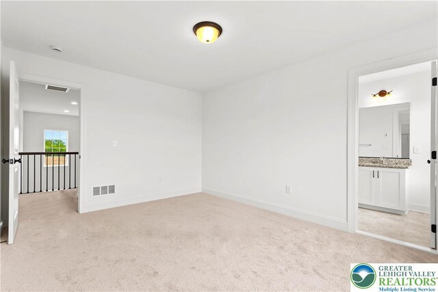 4779 Farrcroft Dr Unit 90, Forks Twp, PA 18040 - unfurnished room with light carpet, baseboards, and a smoke detector