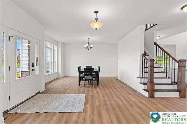 4779 Farrcroft Dr Unit 90, Forks Twp, PA 18040 - foyer entrance with light wood-type flooring, stairway, a chandelier, and baseboards