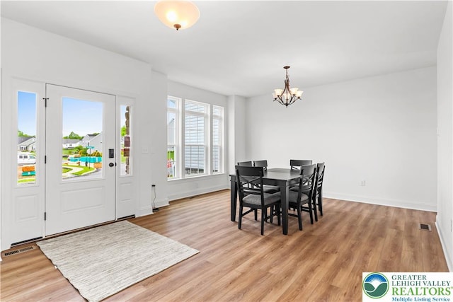 4779 Farrcroft Dr Unit 90, Forks Twp, PA 18040 - dining space with a chandelier, light wood-style flooring, and baseboards