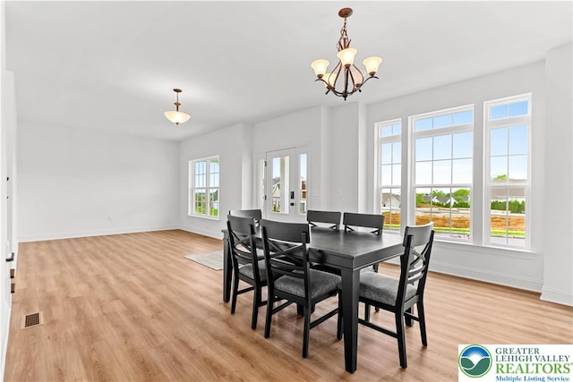 4779 Farrcroft Dr Unit 90, Forks Twp, PA 18040 - dining area featuring a chandelier, light wood-style flooring, and baseboards