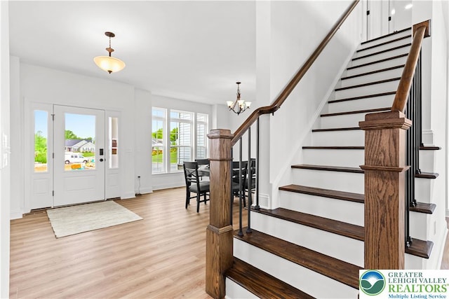 4779 Farrcroft Dr Unit 90, Forks Twp, PA 18040 - entrance foyer featuring a chandelier, light wood-style flooring, stairs, and baseboards