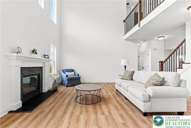 4779 Farrcroft Dr Unit 90, Forks Twp, PA 18040 - living area featuring a high ceiling, wood finished floors, and plenty of natural light