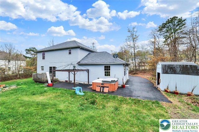 959 Cricket, Tunkhannock Township, PA 18334 - back of house featuring a hot tub, a gazebo, a patio, and a shed