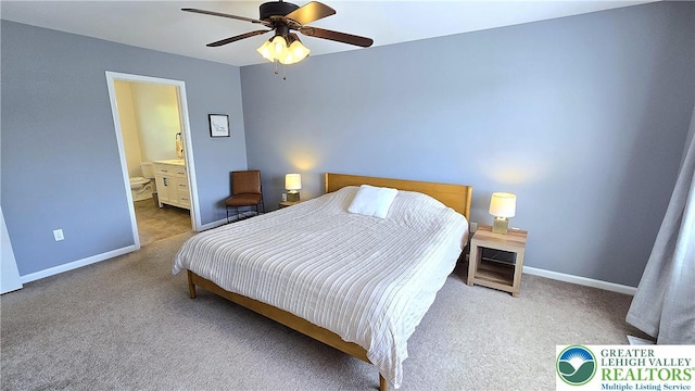 carpeted bedroom featuring baseboards, ensuite bathroom, and ceiling fan