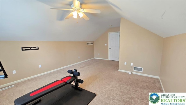 workout area with ceiling fan, carpet flooring, lofted ceiling, and baseboards