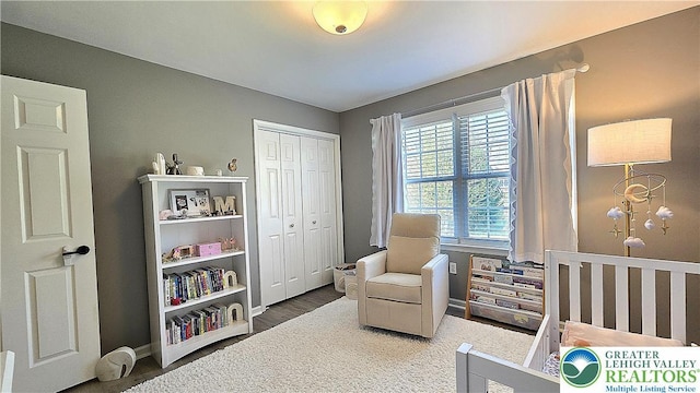bedroom with a closet and baseboards