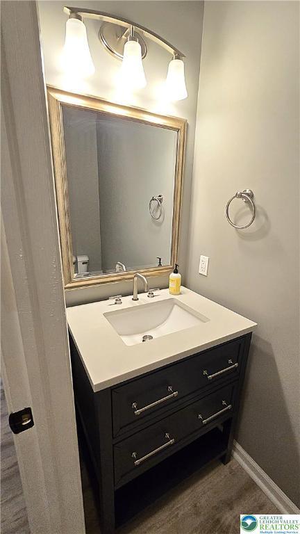 bathroom featuring vanity and baseboards
