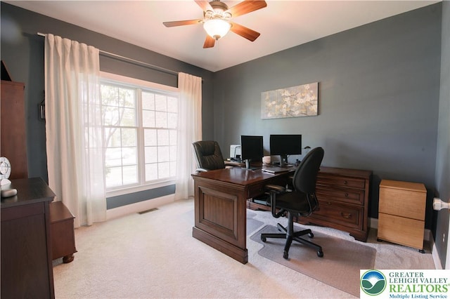 office with light carpet, a ceiling fan, and healthy amount of natural light