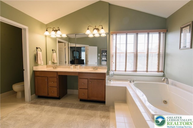 full bath with tile patterned flooring, lofted ceiling, a whirlpool tub, double vanity, and toilet