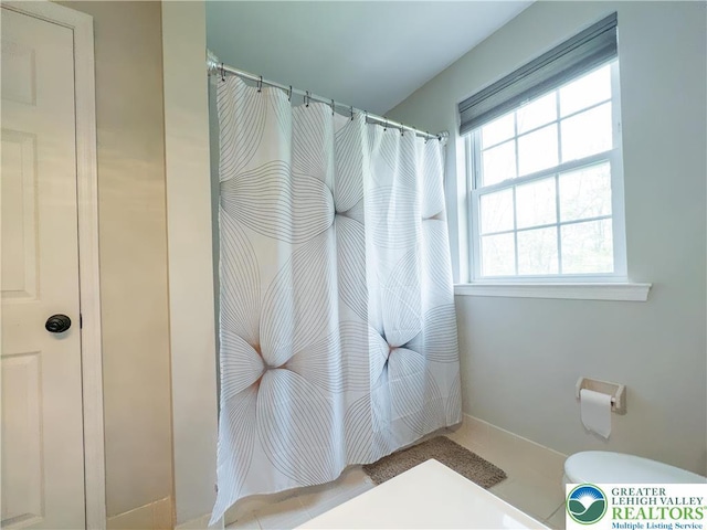 bathroom with curtained shower