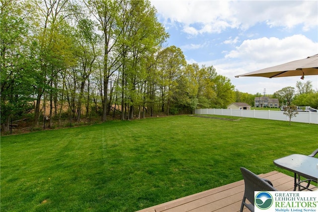 view of yard with a wooden deck