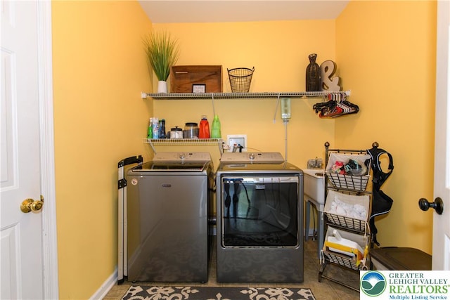 clothes washing area featuring washing machine and dryer