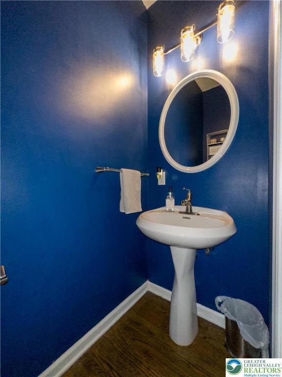 bathroom featuring baseboards and wood finished floors