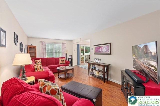 living room with wood finished floors and baseboards