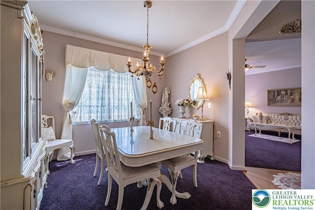 dining space featuring a chandelier, carpet flooring, ornamental molding, baseboards, and ceiling fan