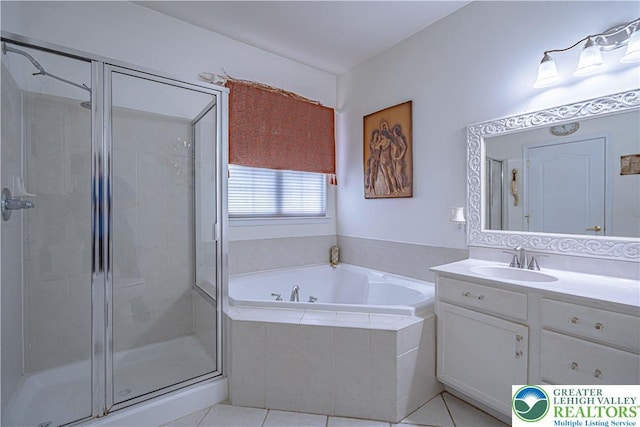 full bathroom with a shower stall, a bath, vanity, and tile patterned floors