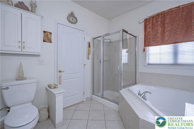 full bathroom featuring a shower stall, a garden tub, tile patterned floors, and toilet