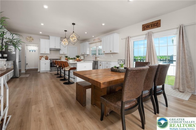 dining room featuring light wood-style floors and recessed lighting