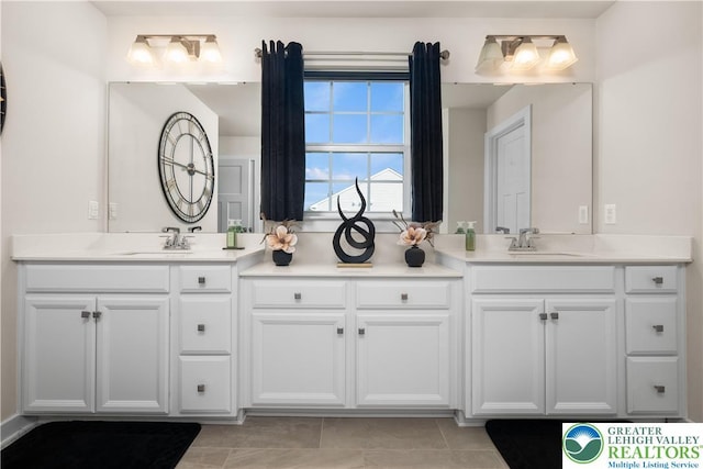 bathroom with vanity and tile patterned flooring