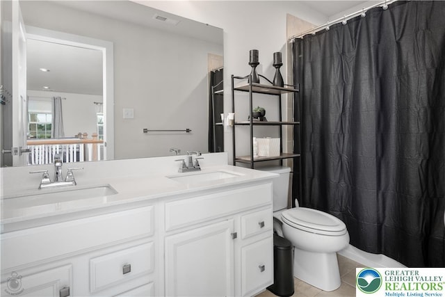 full bath with tile patterned floors, toilet, double vanity, and curtained shower