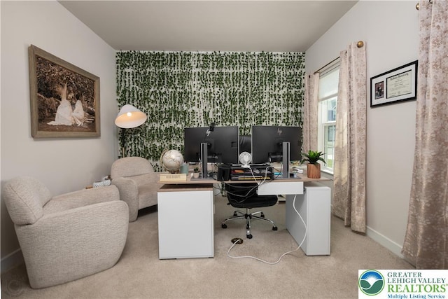 office area featuring an accent wall, carpet floors, and baseboards