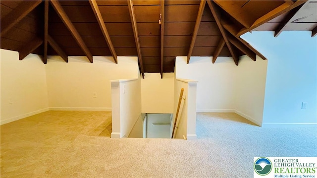 staircase with carpet floors and baseboards