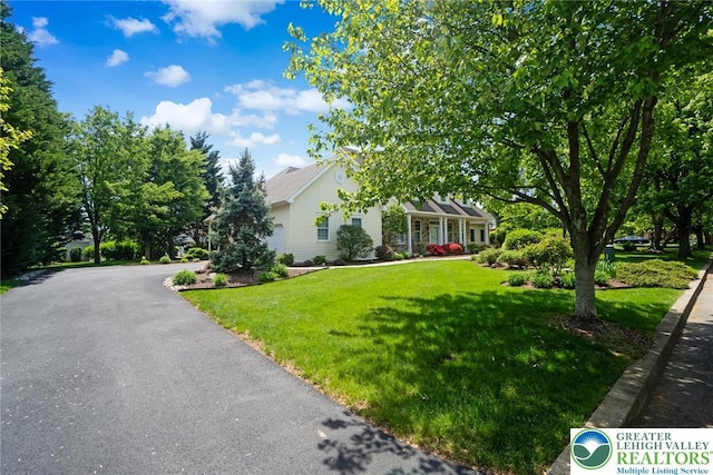 view of front of home with a front lawn