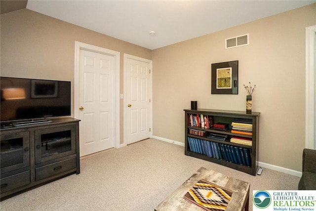 sitting room with carpet and baseboards
