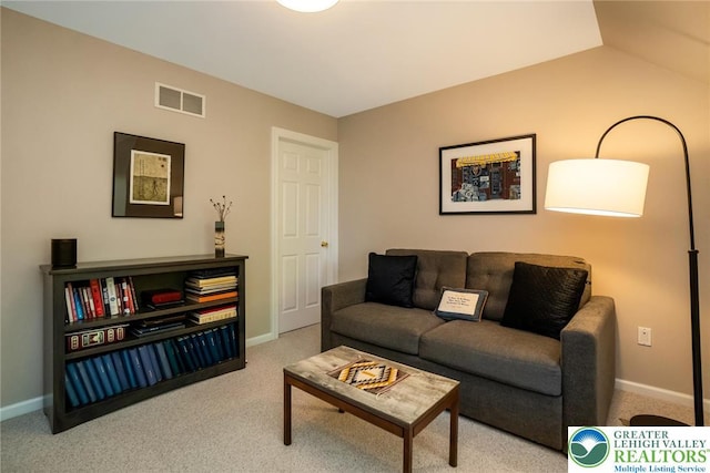 living room with carpet flooring and baseboards