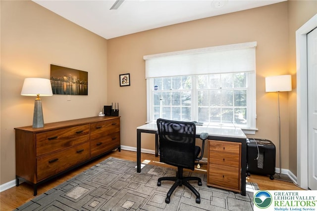 office space featuring light wood finished floors and baseboards
