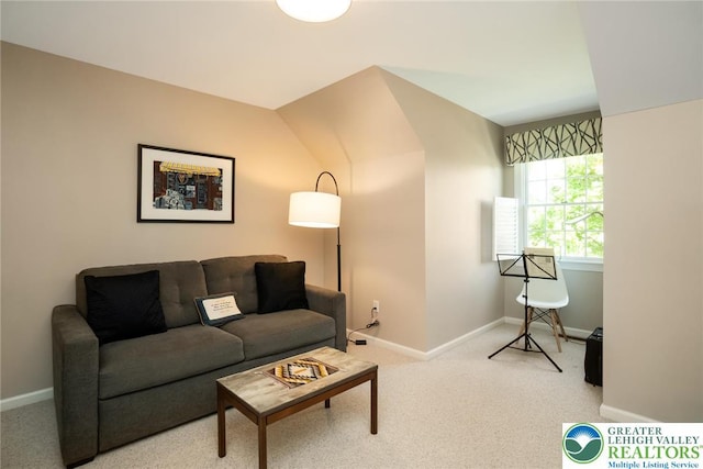 carpeted living room featuring baseboards