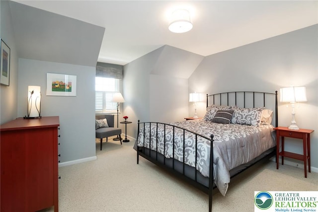 bedroom with carpet flooring and baseboards