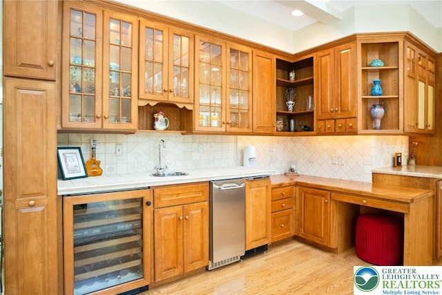 kitchen featuring beverage cooler, open shelves, a sink, and light countertops