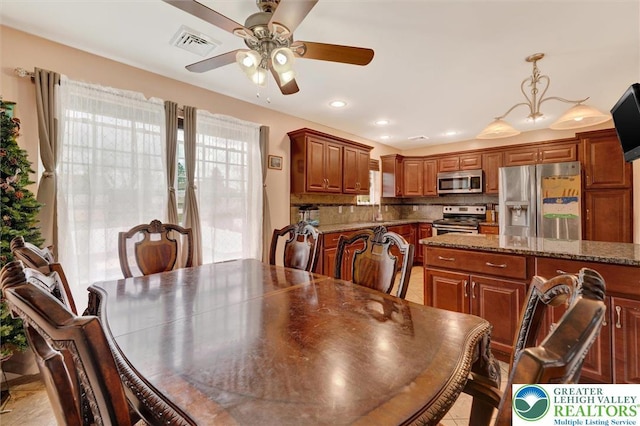dining area featuring a ceiling fan and recessed lighting