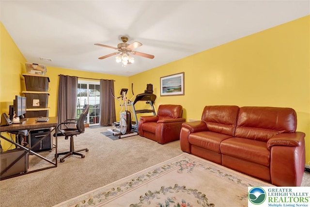 home office featuring carpet flooring and ceiling fan