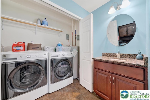 clothes washing area featuring independent washer and dryer