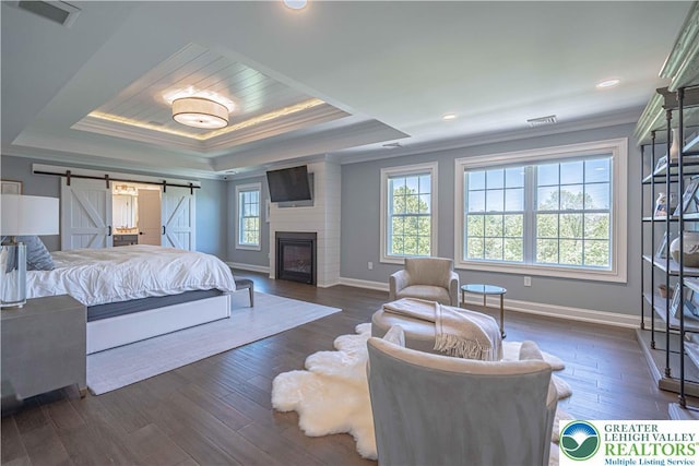 bedroom with crown molding, multiple windows, a raised ceiling, baseboards, and recessed lighting