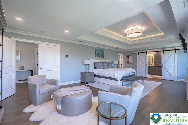 bedroom with a barn door, ornamental molding, dark wood-type flooring, baseboards, and recessed lighting
