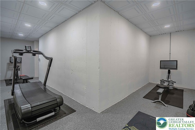 exercise room with recessed lighting and an ornate ceiling