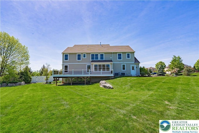 back of property featuring a deck
