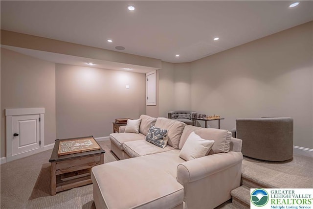living room with light colored carpet, recessed lighting, and baseboards