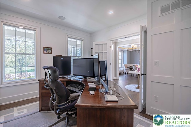office featuring healthy amount of natural light, baseboards, a chandelier, and recessed lighting