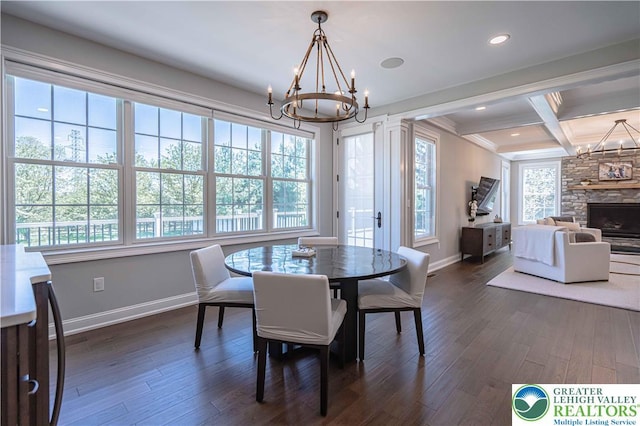 dining space featuring baseboards, a chandelier, dark wood-style floors, beam ceiling, and crown molding