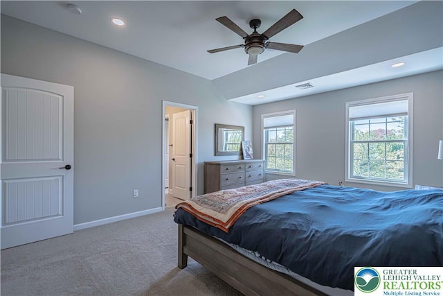 carpeted bedroom with baseboards, vaulted ceiling, and recessed lighting