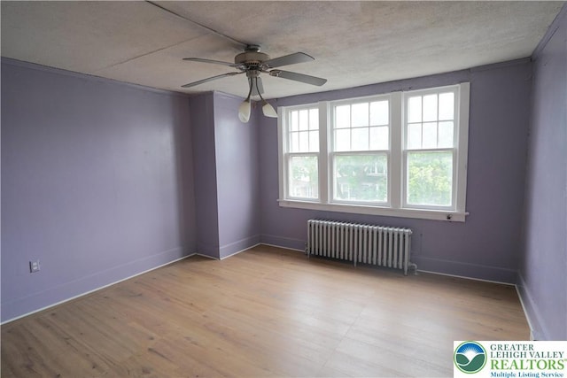 330 18th St, Allentown City, PA 18104 - empty room featuring radiator heating unit, healthy amount of natural light, ceiling fan, and baseboards