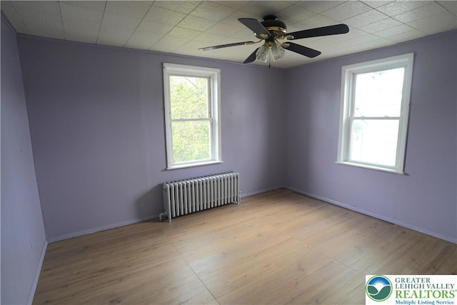 330 18th St, Allentown City, PA 18104 - empty room with radiator heating unit, wood finished floors, baseboards, and ceiling fan
