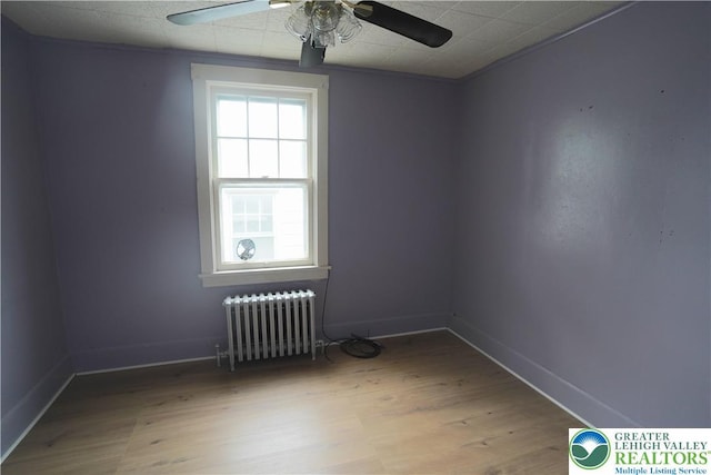 330 18th St, Allentown City, PA 18104 - unfurnished room with radiator, a ceiling fan, wood finished floors, and baseboards