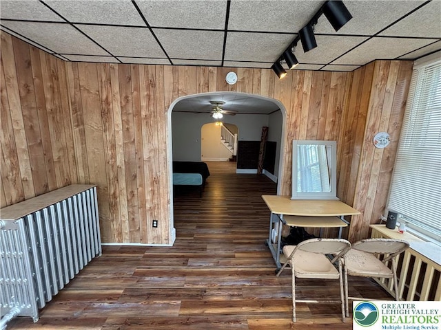 330 18th St, Allentown City, PA 18104 - dining space featuring arched walkways, wood walls, wood finished floors, baseboards, and a paneled ceiling