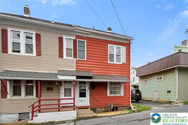 multi unit property featuring a chimney