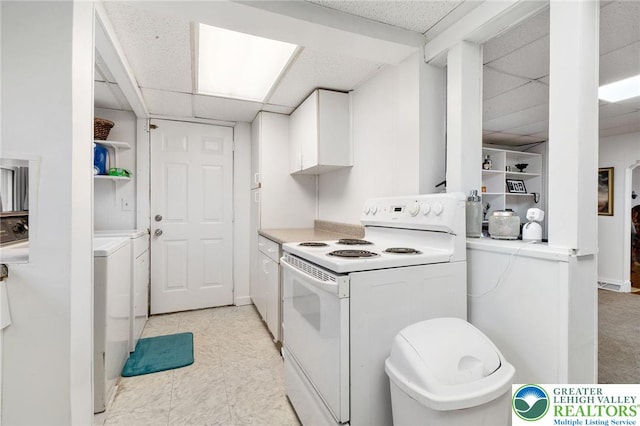 kitchen featuring white electric stove, a paneled ceiling, white cabinets, light countertops, and washer / clothes dryer
